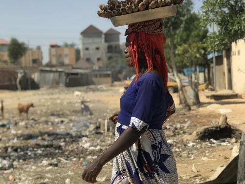 A woman carries products to market in the traditional manner in Chad's capital, N'Djamena.